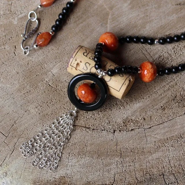 Long tassel necklace with red and black agate