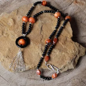 Long tassel necklace with red and black agate