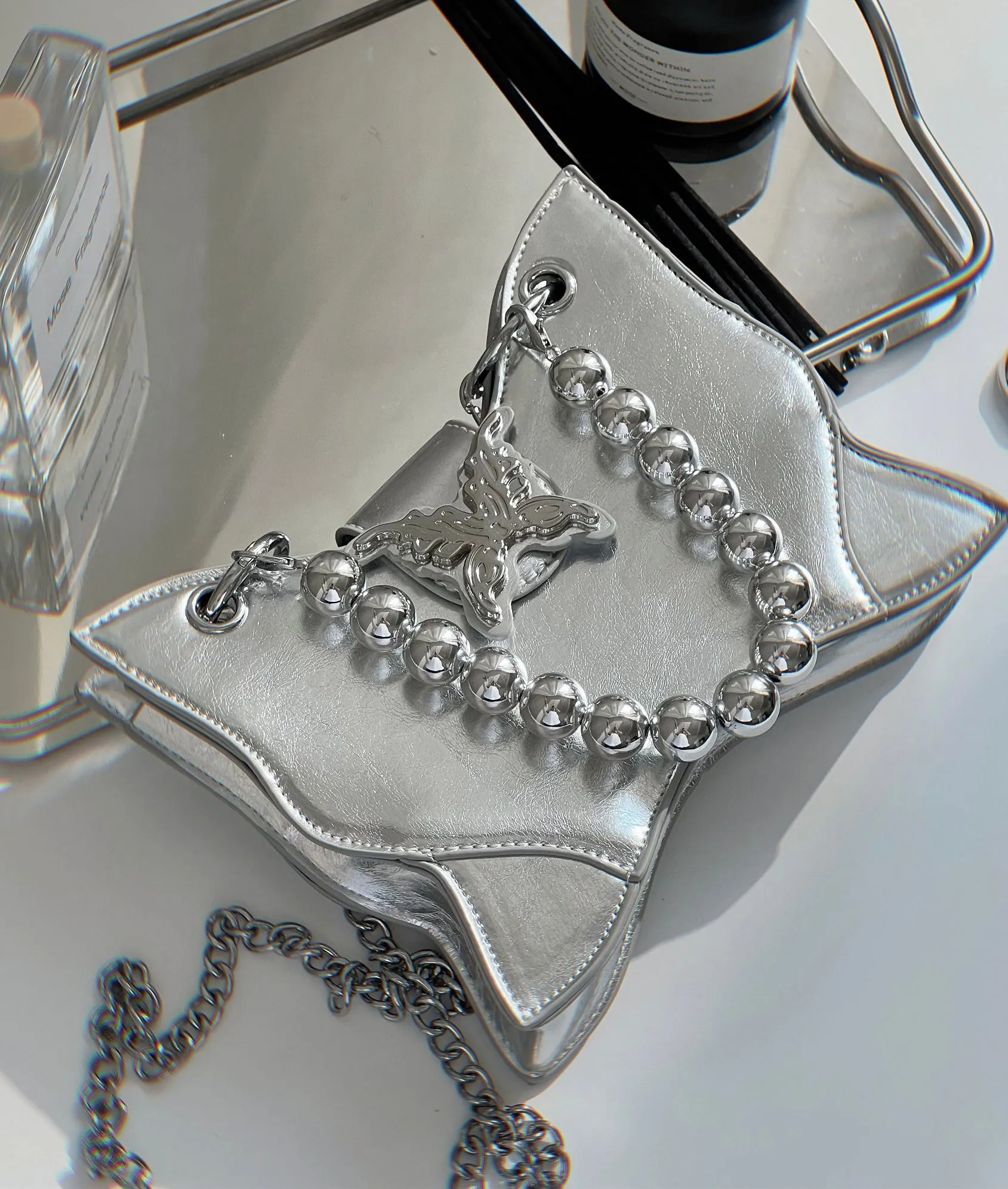 Mariposa Silver Butterfly Wings Shaped PU Leather Solid Color Textured Wide Shoulder Bag Handbag