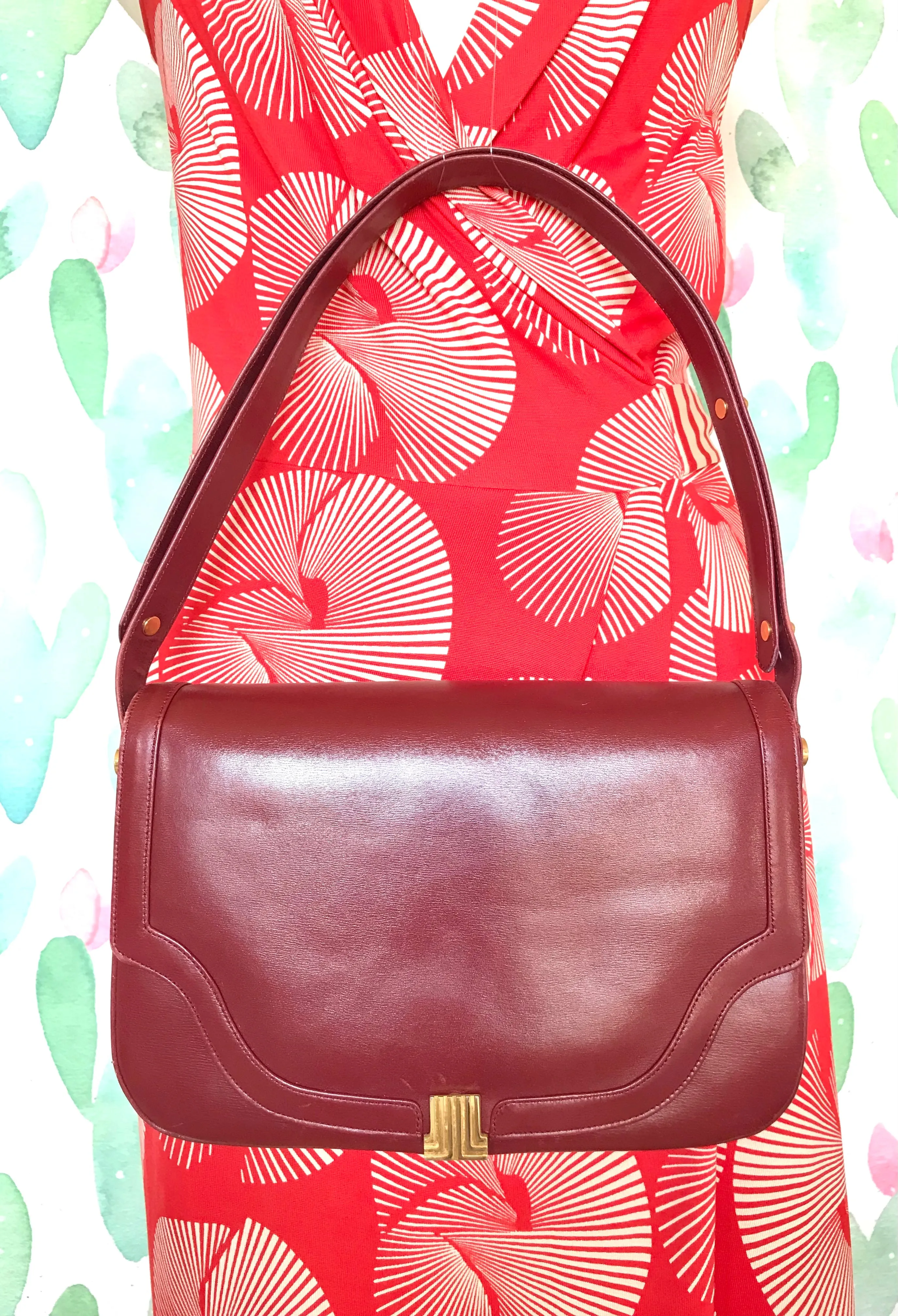 Vintage Lanvin wine leather shoulder bag with golden logo motif closure. Classic must have purse. 060620r2