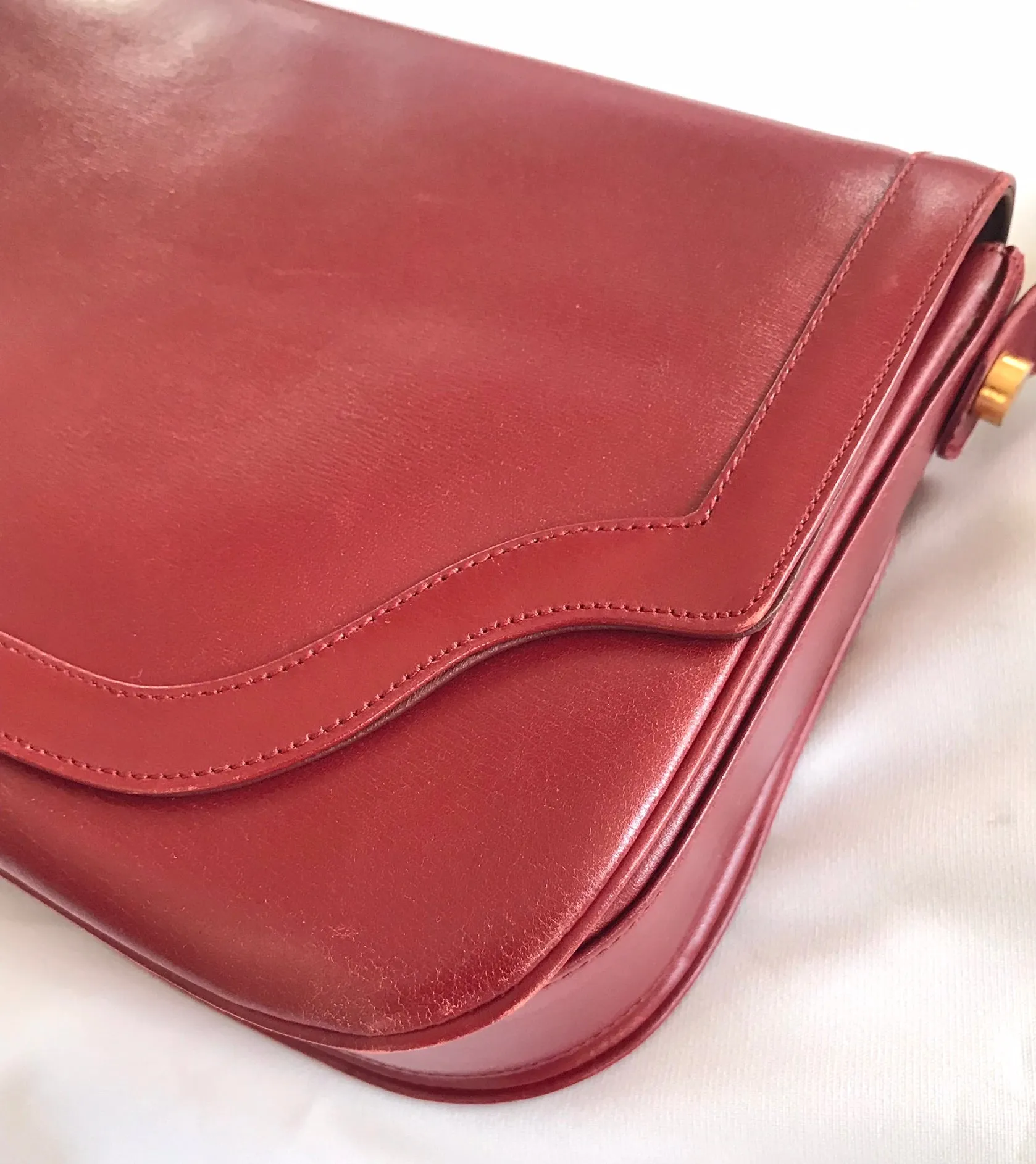 Vintage Lanvin wine leather shoulder bag with golden logo motif closure. Classic must have purse. 060620r2