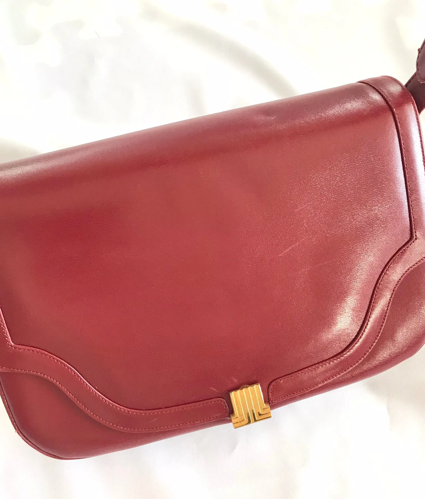 Vintage Lanvin wine leather shoulder bag with golden logo motif closure. Classic must have purse. 060620r2