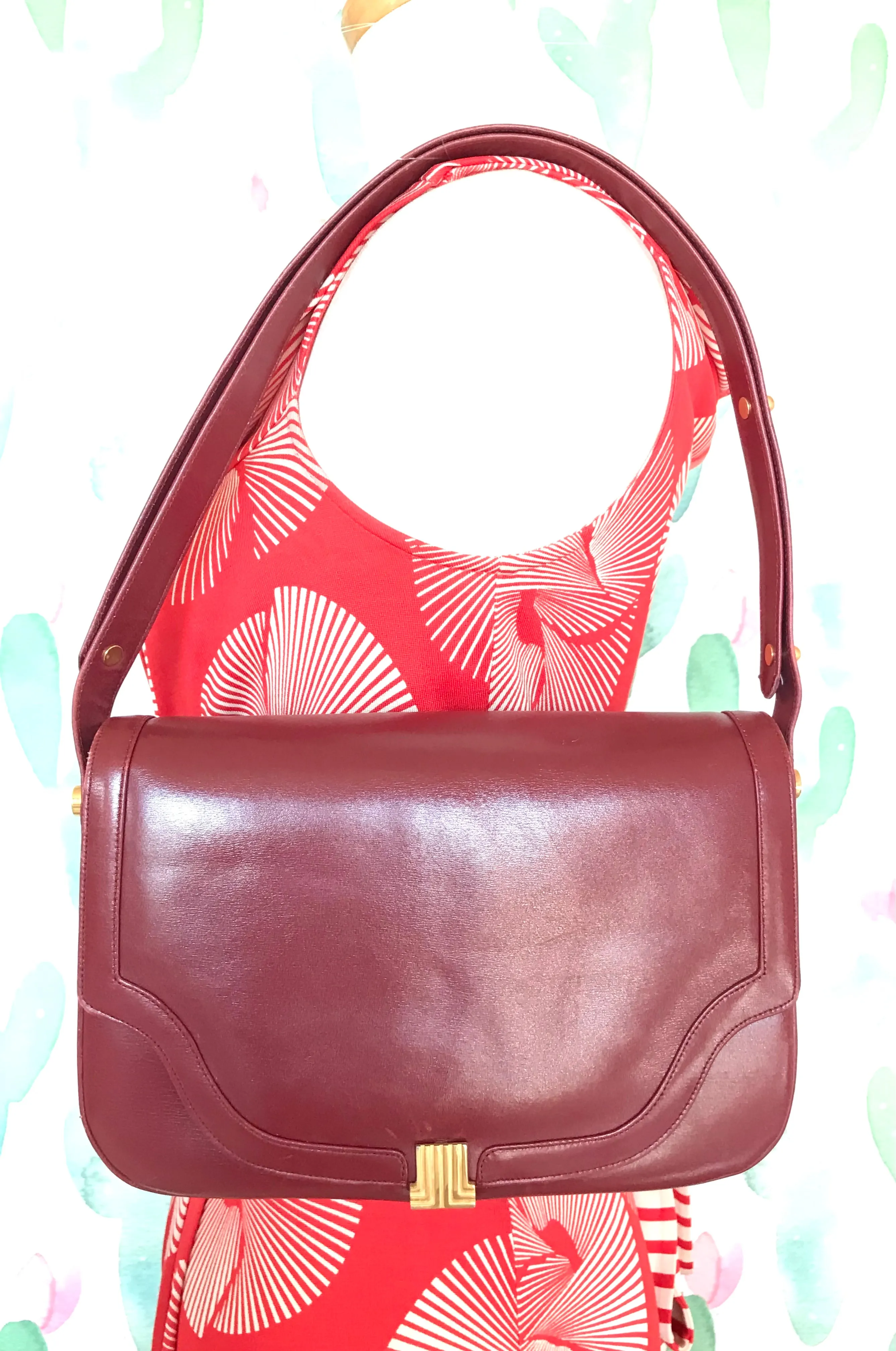 Vintage Lanvin wine leather shoulder bag with golden logo motif closure. Classic must have purse. 060620r2