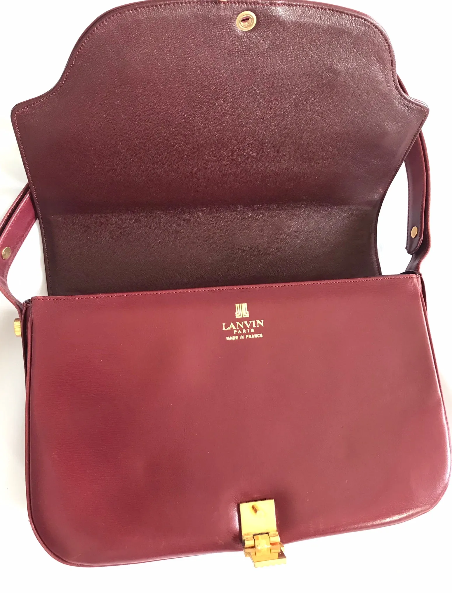 Vintage Lanvin wine leather shoulder bag with golden logo motif closure. Classic must have purse. 060620r2