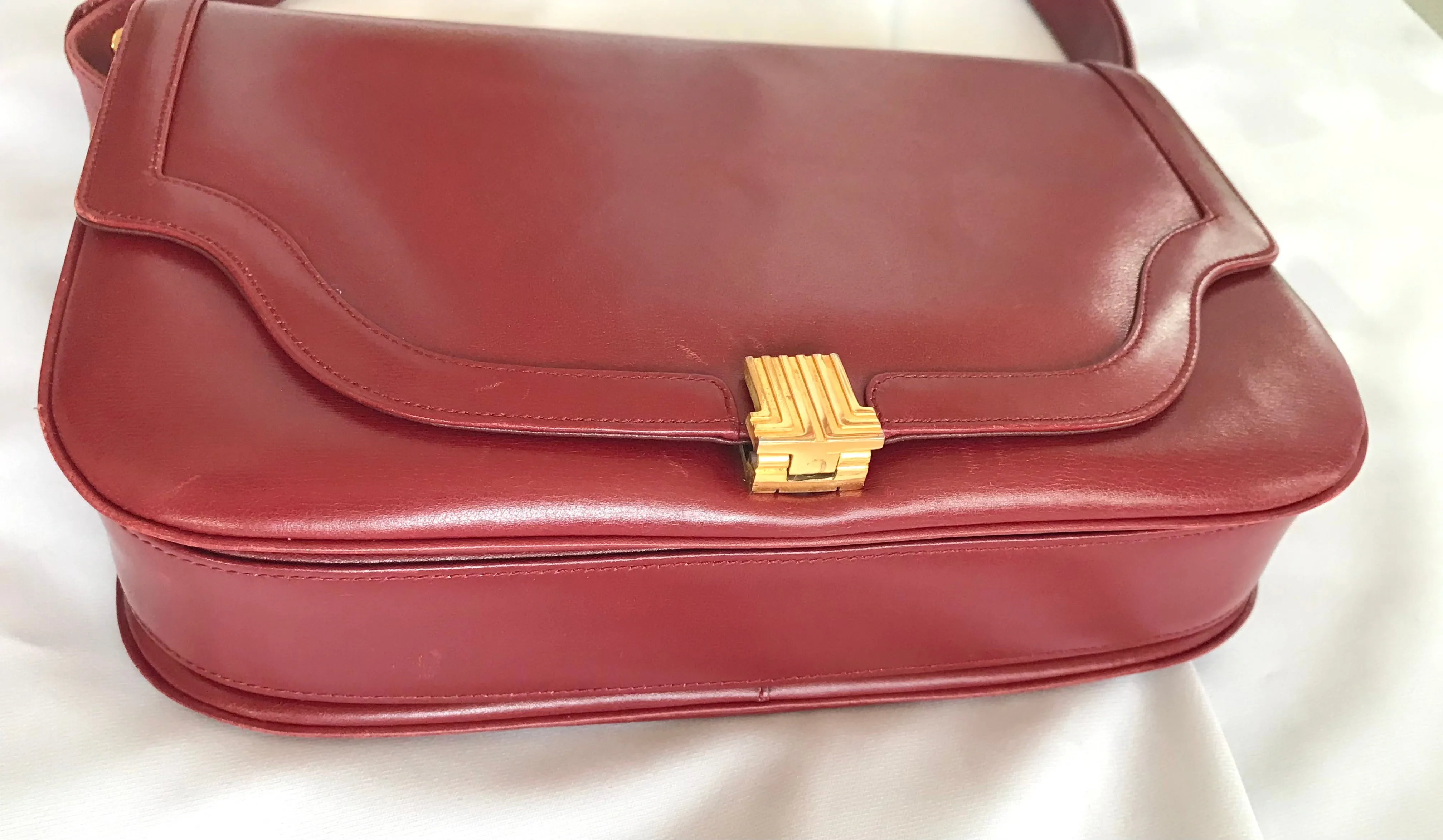 Vintage Lanvin wine leather shoulder bag with golden logo motif closure. Classic must have purse. 060620r2